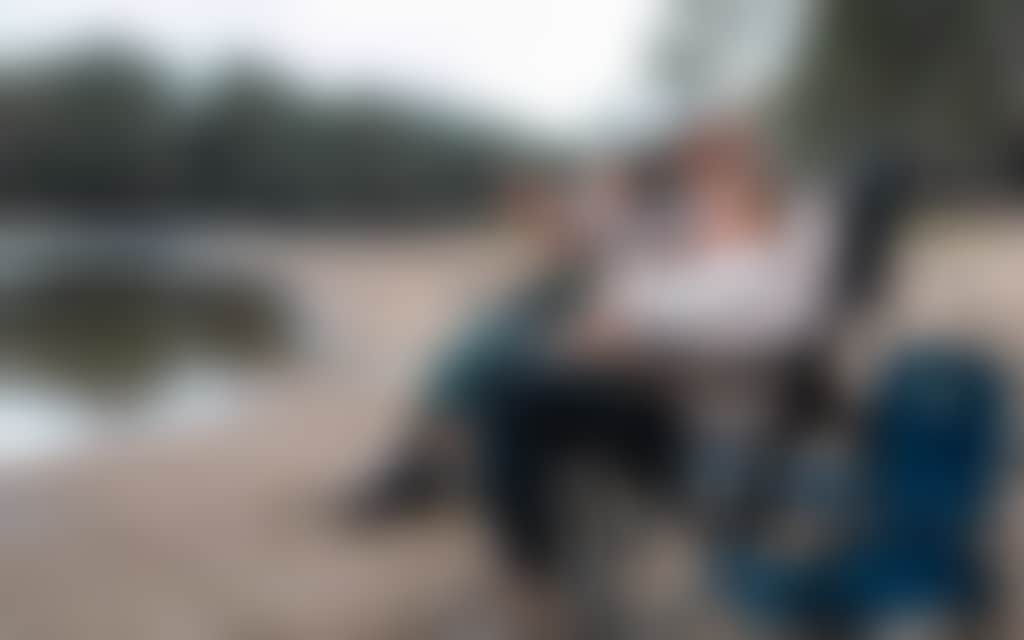 Winter family in chairs by river