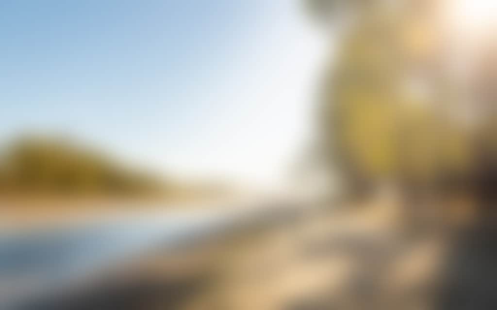Two women walking on the bank of the murray river
